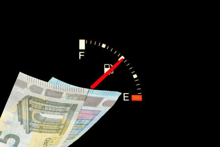 A fuel gauge in the car, petrol costs and euro bills