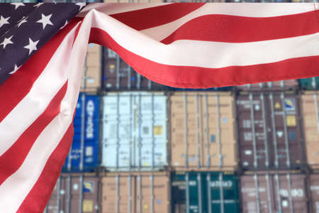 Flag of the USA and containers in the portの写真素材