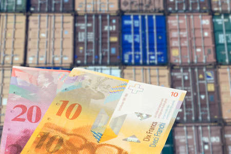 Containers in the port and Swiss franc money