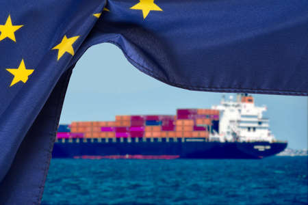 European Union EU flag and a container shipの写真素材