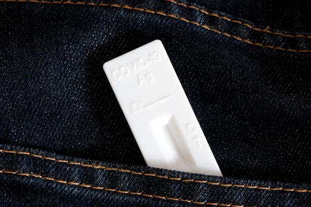 A corona test in a jeans pocket