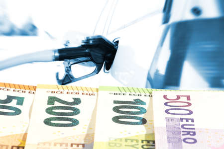 Car at gas station and euro moneyの写真素材