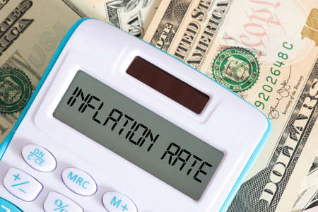 Dollar banknotes, calculator and inflation in USAの写真素材