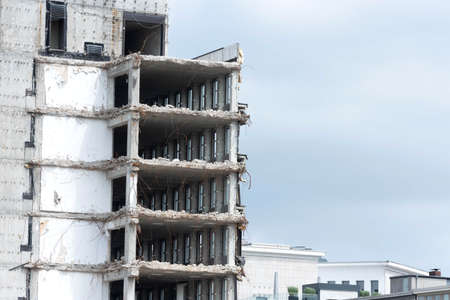 A skyscraper is being demolishedの写真素材