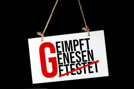 A sign saying 2G regulation Covid-19の写真素材