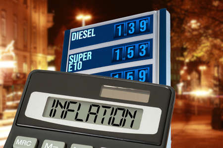 Gas station, price board with high fuel prices and inflationの写真素材
