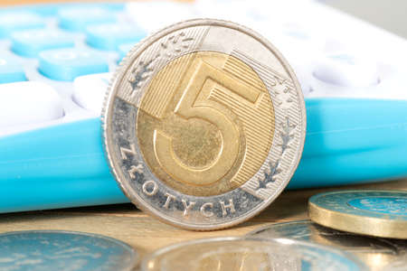 Calculator and coin Polish zloty PLNの写真素材