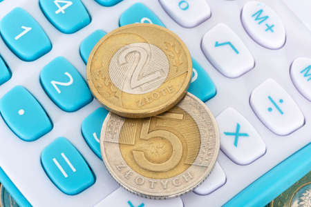 Calculator and coin Polish zloty PLNの写真素材