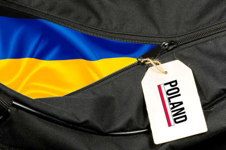 A bag and flags of Ukraine and Polandの写真素材