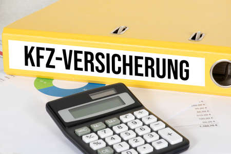 Calculator and folder car insuranceの写真素材