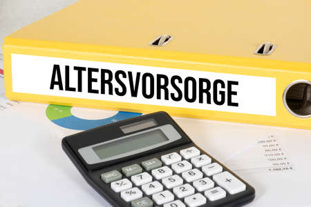 Calculator and folder for retirement savingsの写真素材