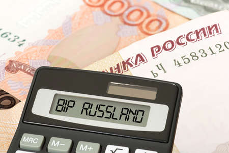 Ruble banknotes, calculator and gross domestic product Russiaの写真素材