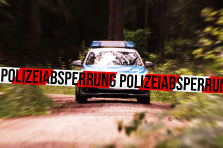 Police car and cordon at crime sceneの写真素材