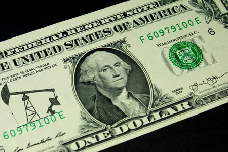Dollar bill and price of oil and fuelの写真素材
