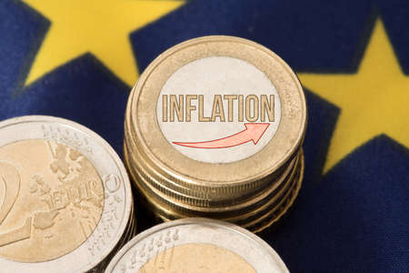 European Union flag EU, euro coin and rising inflationの写真素材