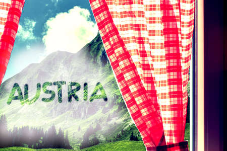 Alpine landscape with red curtains and the word austria written in itの写真素材