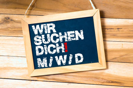 Blackboard with text on wooden backgroundの写真素材