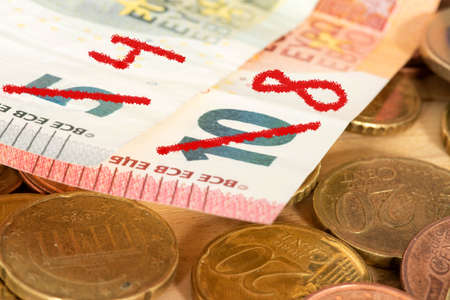 Euro banknotes and coins close-up. Economic crisis concept.