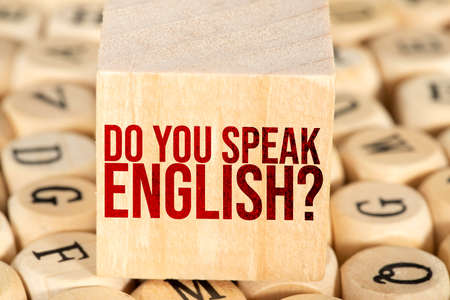 Business and finance concept. On the table are wooden cubes with the inscription - Do you speak Englishの写真素材