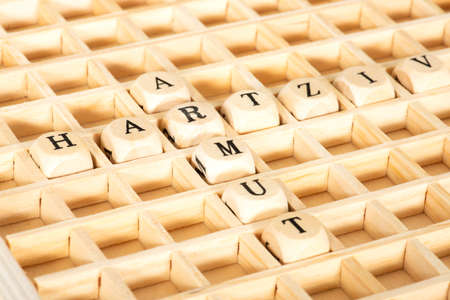 Wooden blocks with word ARRIVAL on table, closeupの写真素材