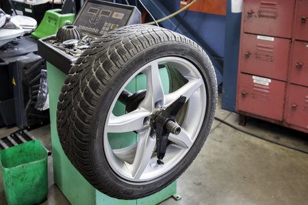 Wheel alignment in a car repair shop. Auto service industry concept.の写真素材