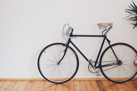 Vintage bicycle in the room with white wall background - Vintage Filterの写真素材