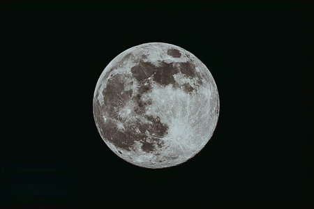 Full moon in the night sky, can be used as background.