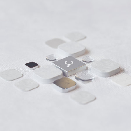 A closeup shot of buttons on a white background with selective focus