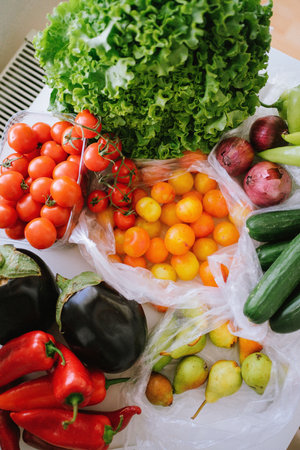 Vegetables and fruits in plastic bags. Healthy food concept.の写真素材