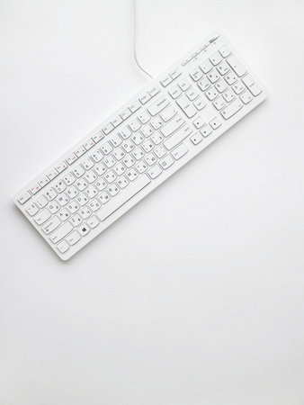 White keyboard isolated on white background. Top view. Copy space.