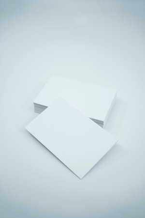 Blank business cards isolated on white background. Mockup for branding identity.の写真素材