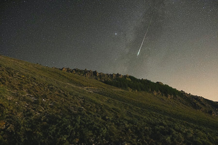Night starry sky with milky way over mountains. Long exposure.の写真素材