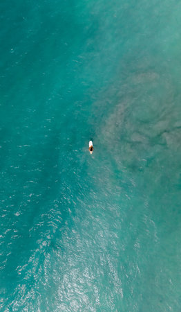 Aerial view of a small boat in the turquoise seaの写真素材