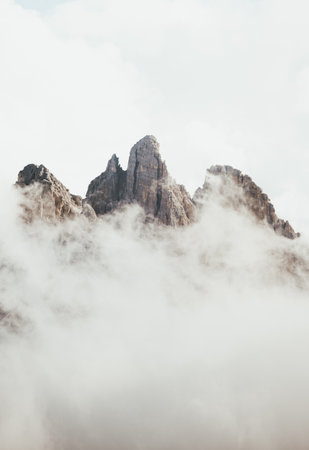 Mountain landscape with clouds and fog in Dolomites, Italyの写真素材