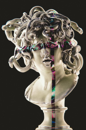 Antique statue of a woman's head on a black background.の写真素材