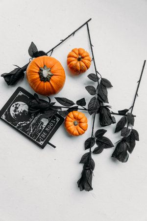 Halloween decorations with pumpkins on white background. Flat lay.