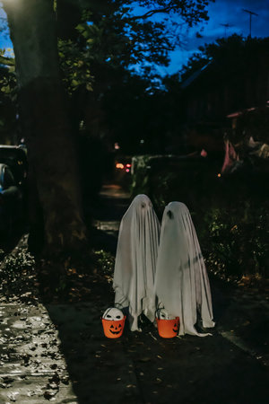 Halloween decorations on the street with pumpkins, ghosts and candles