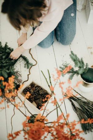 Florist at work. Young woman making beautiful bouquet of flowers in flower shop