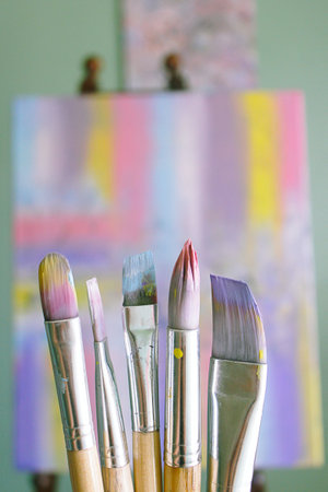 Paintbrushes in the artist's studio, closeup of photo