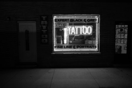 Black and white photo of a neon sign in the subway station.の写真素材