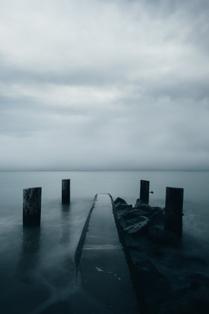 Wooden breakwaters in the Baltic Sea. Long exposure photo.の写真素材