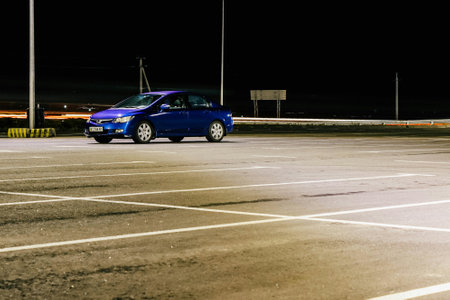 car in the parking lot at night, note shallow depth of fieldの写真素材