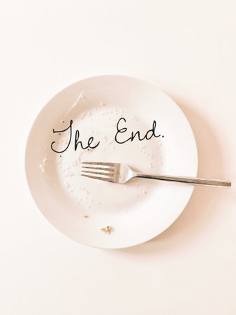 White plate with fork on a white background with the text