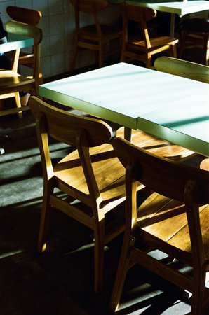 Wooden table and chairs in a cafe. Selective focus.
