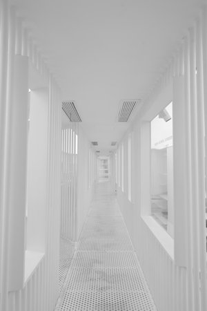 White corridor in modern office building, perspective view, black and whiteの写真素材