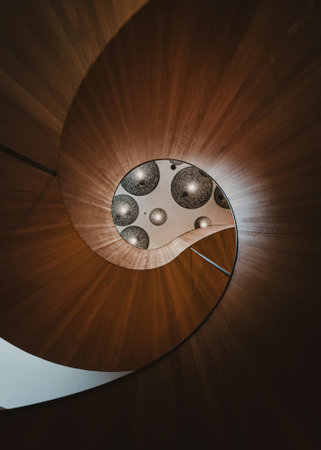 Wooden spiral staircase with a circular pattern in the shape of a circleの写真素材