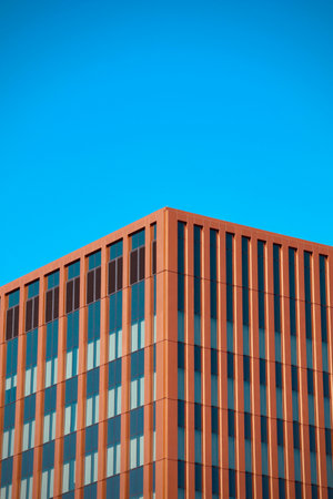 Modern office building with blue sky background. Architectural detail of modern office building.の写真素材