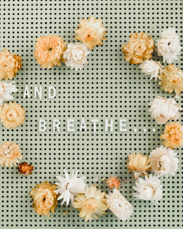 Flowers composition. Frame made of dried flowers on gray background. Flat lay, top view, copy space