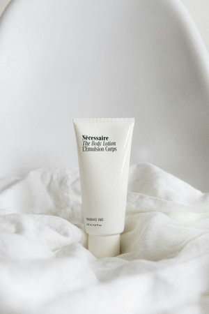 A tube of cosmetic cream on a white background.