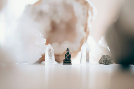 Buddha statue made of pieces of stone on white background.の写真素材